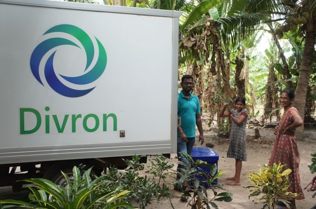 A Divron reefer truck collecting from a village